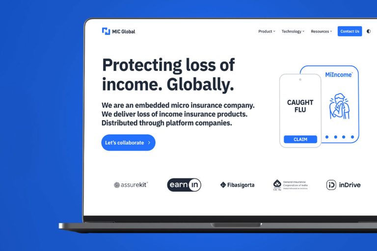 MIC Global website homepage on laptop screen