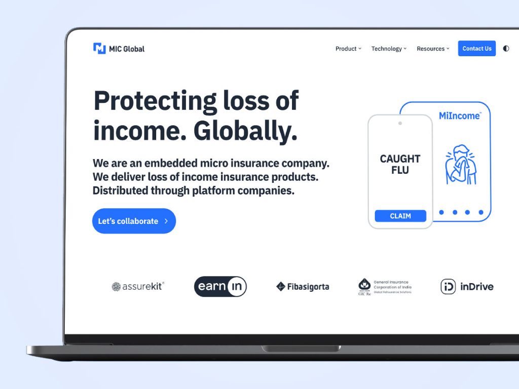 MIC Global website homepage on laptop screen